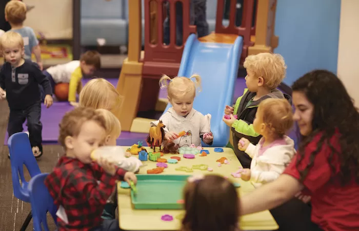 Pre-Schoolers at the Y's Early Learning Center playing with various toys